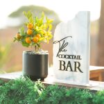 The Cocktail Bar sign on a bar