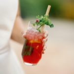 Bride holding cocktail