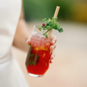 Bride holding cocktail