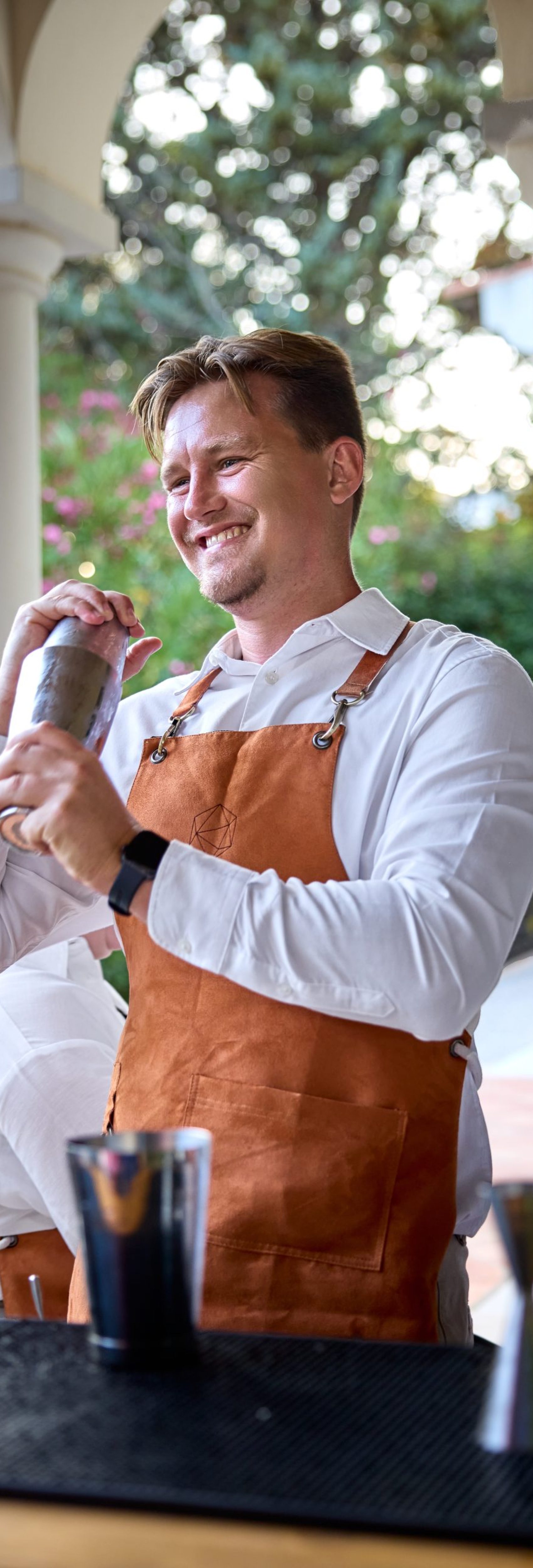 Jaime founder of Southside bartending at an event